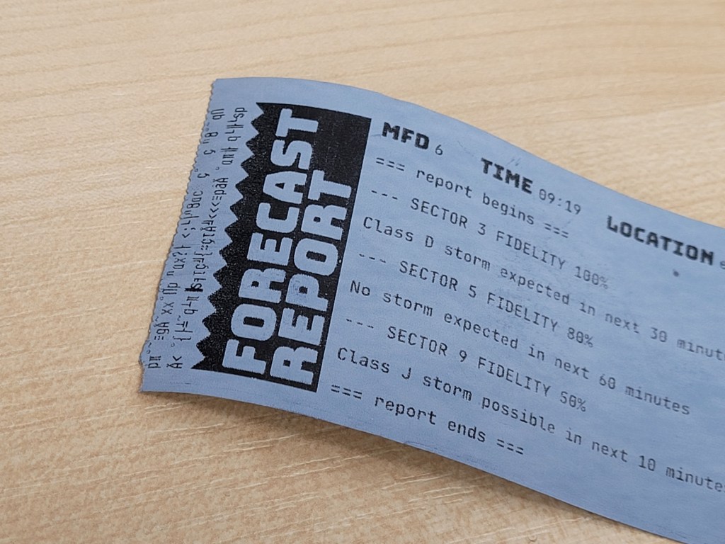 A forecast report from the Strandfall receipt printer. On one edge, the receipt erroneously shows garbled text.