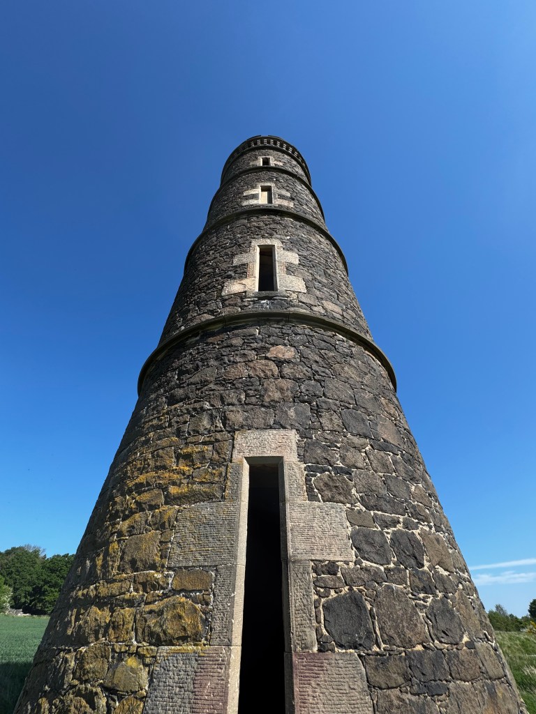 A stone tower in a park